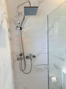 a shower with a shower head in a bathroom at Casa Rural Encantadora Con Terraza Privada in Arona +24 photos