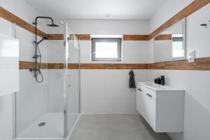 a bathroom with a shower and a sink at The Houses - Chata u sjezdovky 2 in Velké Meziříčí