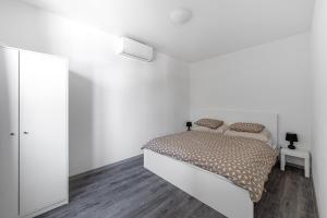 Postel nebo postele na pokoji v ubytování The Houses - Chata u sjezdovky 2