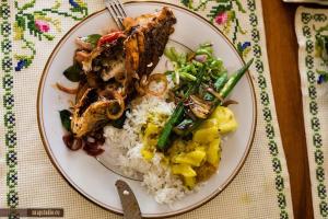a plate of food with rice and meat and vegetables at Villa Senowin in Anuradhapura