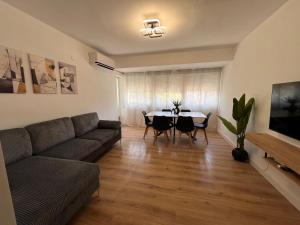 a living room with a couch and a table at El Surtidor in Anna