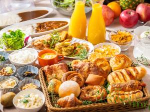a table topped with lots of different types of food at APA Hotel Roppongi SIX in Tokyo