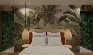 a bedroom with a bed with plants on the wall at Escape - Suite with Balneo and Sauna - Downtown in Pontarlier +2 photos