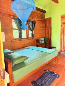 Postel nebo postele na pokoji v ubytování Wilpattu Jungle Resort