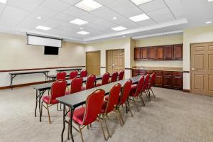 a conference room with a table and red chairs at Country Inn & Suites by Radisson, Princeton, WV in Princeton +96 photos
