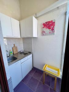 Kuchyň nebo kuchyňský kout v ubytování Rooms & Apartments Hegic