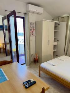 Postel nebo postele na pokoji v ubytování Rooms & Apartments Hegic