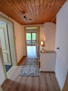 a hallway of a home with a wooden ceiling at Ferienwohnung am Staufen in Piding
