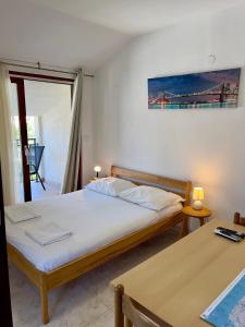 Postel nebo postele na pokoji v ubytování Rooms & Apartments Hegic