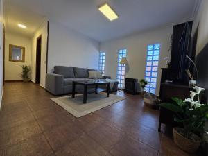 a living room with a couch and a table at La Planta Vieja III in La Orotava +9 photos