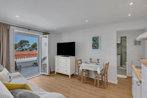 TV a/nebo společenská místnost v ubytování Apartments Piano