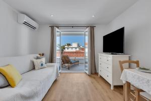TV a/nebo společenská místnost v ubytování Apartments Piano