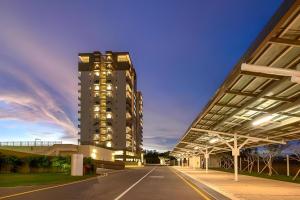 a tall building with lights on in front of it at Fairway Galle Cozy 2BR Apartment Near Beach & City in Galle