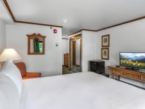 Voodi või voodid majutusasutuse Christiania Lodge toas