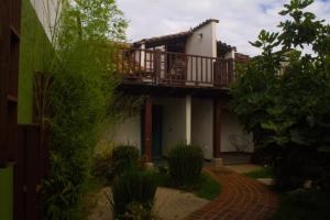 a house with a deck on the side of it at Casa Dabne in San Cristóbal de Las Casas
