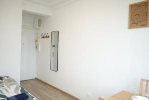 a room with a white wall with a door at Vaugirard1 Appt Paris 15, Eiffel Tower View in Paris +13 photos