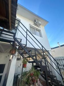 a stairway with potted plants on a building at Depto Colon ER in Colón