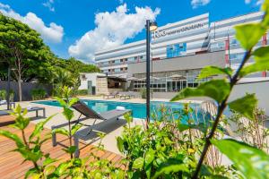 a view of a hospital building with a swimming pool at Rio Hotel by Bourbon Indaiatuba in Indaiatuba