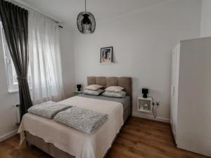 Postel nebo postele na pokoji v ubytování Apartman Rakanović + 7 fotografií