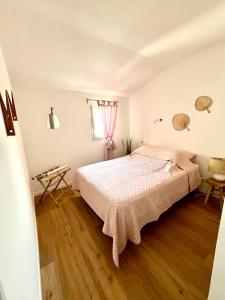 Postel nebo postele na pokoji v ubytování La Camargue bohème