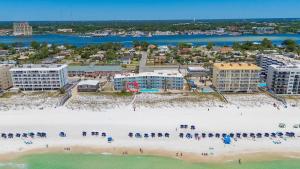 an aerial view of a beach with a group of people at Aqua Villa #105 Beachside 2 bedroom condo in Fort Walton Beach