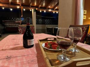 a bottle of wine and a plate of food on a table at Villa Tamaris hidden gem near beach in Jadrija