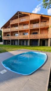 a large blue pool in front of a building at Andrea 's 4 seasons in Albrechtice v Jizerských horách