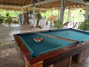 a pool table with balls on top of it at Casa Paraiso Hotel Boutique in Puerto Escondido