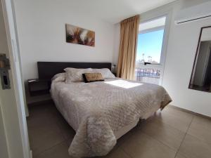 Кровать или кровати в номере Departamento Godoy Cruz