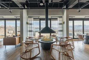 a living room with a table and chairs and mountains at Downtown Mountain Views Fire pit Free Pkg Gym in Salt Lake City