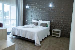 Postel nebo postele na pokoji v ubytování Garda Hotel