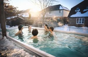 a group of people in a swimming pool in the snow at PARADISE SHARED SHORT STAy in Bowmanville