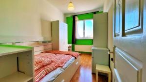 a small room with a bed and a window at BeBudgetRooms in Budapest +103 photos