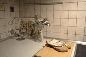 a kitchen counter with a cutting board and some utensils at Oikia Samiotaki Emmanouil in Sarti +42 photos