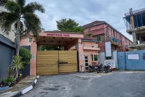 a garage with two motorcycles parked in front of a building at Brentwood Park Finest in Lagos