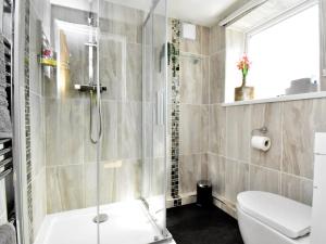 a bathroom with a shower and a toilet at 3 Bed in Kielder 78280 in Falstone +21 photos