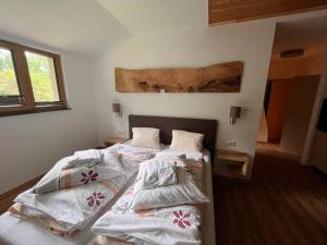 two beds in a room with white sheets at Familienbauernhof Glawischnig-Hofer in Gmünd in Kärnten +40 photos