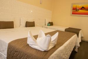 Postel nebo postele na pokoji v ubytování Garda Hotel
