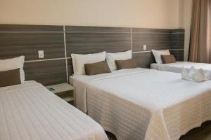 Postel nebo postele na pokoji v ubytování Garda Hotel