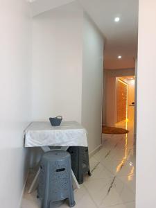 a table with a vase on it in a room at El jadida in El Jadida