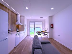 a living room with a couch and a table at San Francisco Central Suites Penthouse in Santa Cruz de Tenerife