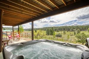 a hot tub in a house with a view at 128 Capitan Circle in Pagosa Springs