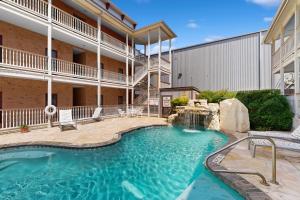 a swimming pool in the middle of a building at The Village at Gruene in New Braunfels