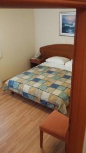 Posteľ alebo postele v izbe v ubytovaní Apartments and Rooms Astoria