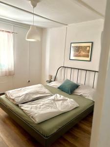 a bedroom with two beds in a room at Rege 32 Vendégház in Szántód
