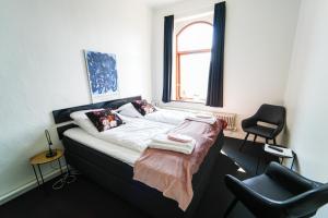 Voodi või voodid majutusasutuse Hotel Phønix Brønderslev toas