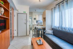Η κουζίνα ή μικρή κουζίνα στο Central Aplotaria Apartment