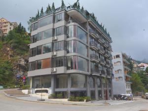 a tall building on a street with at Sapa Vista Hotel in Sapa