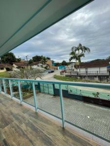 a view of the ocean from a balcony at Residencial Luce Del Sole in Joinville
