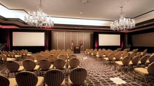 a conference room with rows of chairs and chandeliers at InterContinental Kansas City at the Plaza by IHG in Kansas City +88 photos